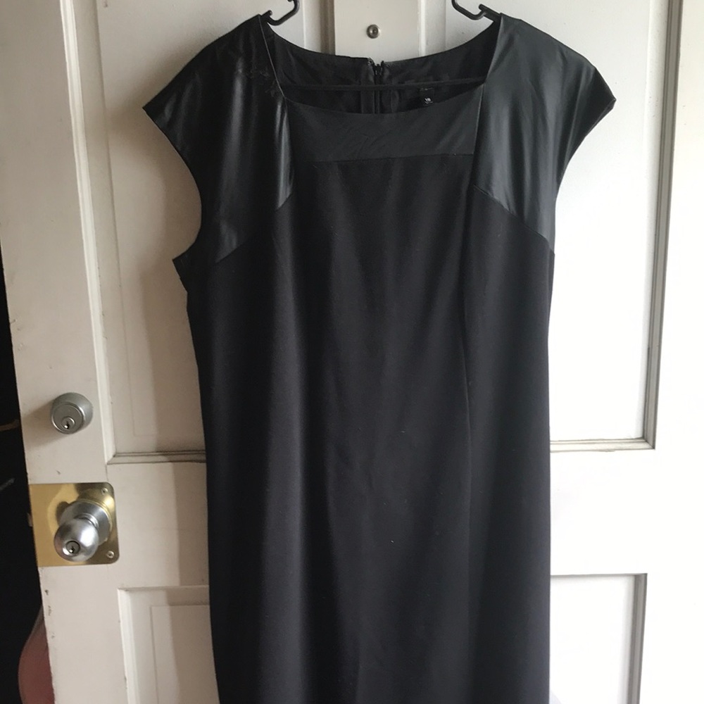 Black dress with leather collar.